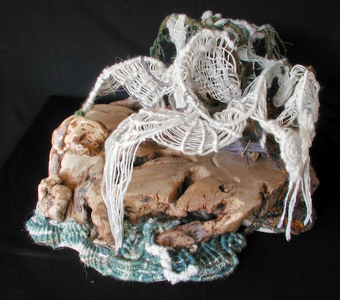 Athena weaves a fog, in this view suggesting the shape of a spider